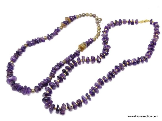 PAIR OF AMETHYST NECKLACES; 2 TUMBLED AMETHYST NECKLACES WITH GOLD TONE BEADS. ONE IS 16 IN, THE