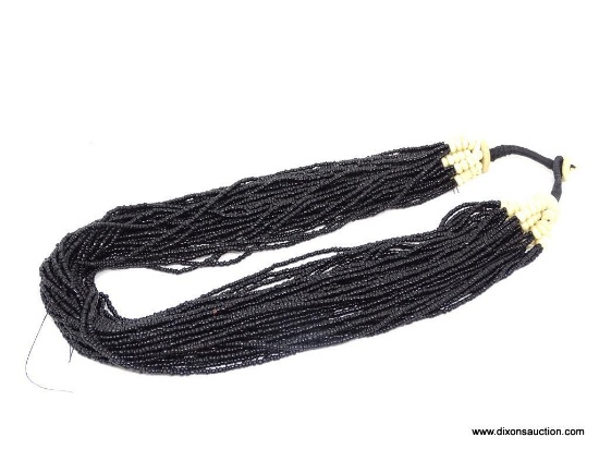 MULTI-STRAND NECKLACE; TRIBAL-LOOK MULTI-STRAND BLACK BEAD NECKLACE WITH BUTTON HOOK CLOSURE.