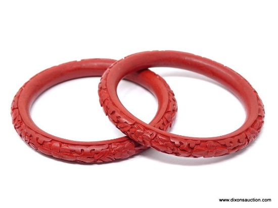 PAIR OF CORAL BRACELETS; 2 ASIAN RED-ORANGE FLORAL CARVED BANGLE BRACELETS. 3.25 IN DIAMETER.