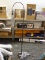 (R1) FLOOR LAMP; METAL FLOOR LAMP WITH A FLOOR PUSH BUTTON, DARK BROWN IN COLOR. HAS A CURVED ARM