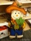 (R2) SCARECROW; METAL BOY SCARECROW ON A ROUND STAND. ITEM NO. 1026605. MODEL NO. LW239-IXJEA012.
