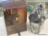 (R1) ALLEN + ROTH WALL LANTERN; CASTINE, AGED BRONZE FINISH WALL LANTERN WITH A CLEAR SEEDED GLASS