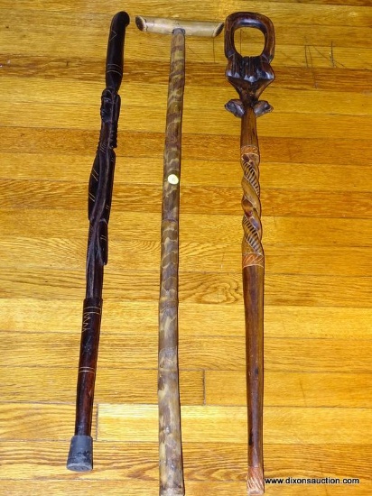 (LR) 3 CANES; 2 AFRICAN CARVED CANES AND AN ORIENTAL BAMBOO STYLE T SHAPED CANE