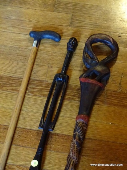 (LR) 3 CANES; 2 AFRICAN CARVED CANES AND AN OAK AND VINYL HANDLE CANE
