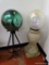 (GARAGE) 2 BALLS AND STANDS; 2 GLASS YARD GAZING BALLS ON STANDS- ONE ON IRON STAND AND OTHER ON A