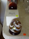 (LR) 3 GLASS BALLS; RUBY RED BALL, MT. ST. HELEN'S GLASS ORNAMENT IN BOX AND SWIRLED GLASS OIL LAMP