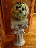 (FRM) BALL ON PEDESTAL; MULTICOLOR YARD GAZING BALL ON CHERUB AND COLUMNED COMPOSITION PEDESTAL