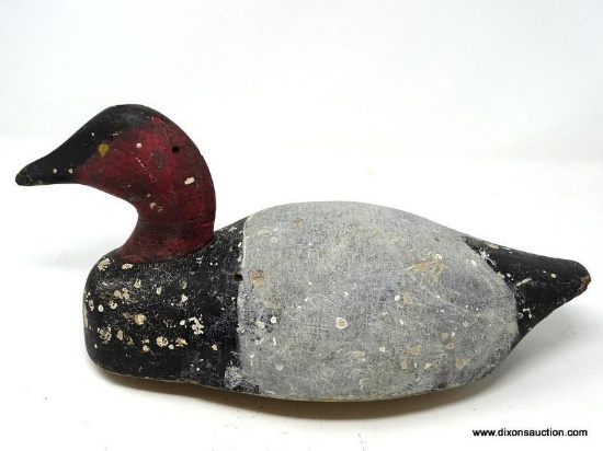 SOLID BODY CANVASBACK DRAKE. WORKING DECOY WITH FLAT BOTTOM. GOOD EARLY PAINT. MEASURES 14 IN X 6 IN