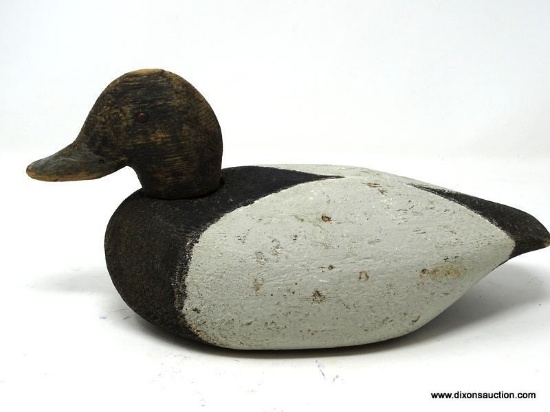 SOLID BODY BLUEBILL. WORKING DECOY WITH FLAT BOTTOM. MOVABLE HEAD; BIRDSHOT PELLETS VISIBLE IN HEAD