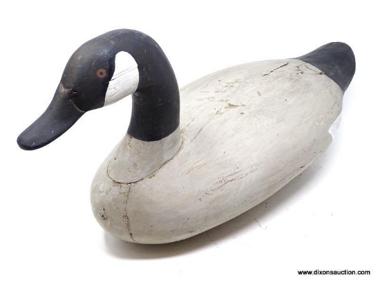 VINTAGE CARVED CANADIAN GOOSE DECOY. SOLID PINE BODY. PAINTED EYES. POSSIBLY MADE BY PAUL GIBSON.