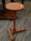 (R3) LAMP TABLE; PEDESTAL TABLE WITH A TURNED POLE STEM LEADING TO A T SHAPED BASE. HAS AN OLD RED