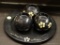 (R4) DECORATIVE PLATE AND VOTIVES; 4 PIECE LOT OF BLACK PAINTED WOODEN BALL SHAPED VOTIVES WITH A
