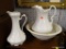 BOWL AND PITCHER SET; MADE FROM SEMI PORCELAIN WITH A CREAM COLOR AND AN ACCOMPANYING SMALLER