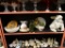 (BAY 6) SHELF LOT; 11 PIECE LOT TO INCLUDE A FOOTED TEA CUP, A DECORATIVE GARDEN BUNNY, A GREEN