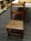 (R1) COUNTRY SIDE CHAIR; PRIMITIVE PLANK SEAT COUNTRY SIDE CHAIR. HAS A 2 SLAT BACK AND AN OLD RED