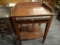 (R2) WOODEN WASH STAND; ANTIQUE SPANISH BROWN PAINTED WASH TABLE WITH A SCALLOPED GALLERY BACK, A