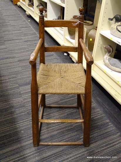 (R1) EARLY LADDER BACK STYLE COUNTRY YOUTH CHAIR; HAS TWISTED RUSH SEATS, NICELY WORN SURFACE, A