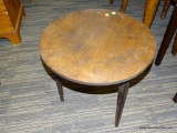 (R2) WALNUT CHILDS TABLE; ROUND TABLE WITH 3 TAPERED LEGS. MEASURES 20 IN TALL WITH A 20 IN