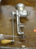 (R2) MEAT GRINDER; METAL COUNTER MOUNTING MEAT GRINDER WITH A WOODEN CRANK HANDLE.