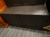 (R4) IKEA CABINET; WOODEN, DARK BROWN FINISH IKEA CABINET WITH 2 PUSH IN CABINET DOORS THAT REVEAL