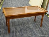 (R4) COFFEE TABLE WITH TRAY TOP; WOODEN COFFEE TABLE WITH A GLASS TRAY IN A WOODEN FRAME WITH 2