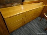 (R4) CHEST OF DRAWERS; 3 X 3 CHEST OF DRAWERS WITH INDENTED HANDLES. MEASURES 77.5 IN X 19.5 IN X