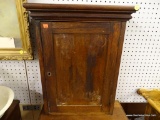 (R1) WALNUT HANGING WALL CUPBOARD; HAS A DOVETAILED CASE WITH SOLID ENDS AND COMES WITH THE KEY.