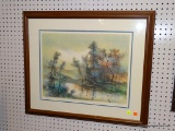 (WALL) FRAMED PRINT SIGNED IN PENCIL; SHOWS A PASTEL COLORED SCENE OF A RIVER ON THE FOREST'S EDGE.