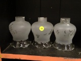 (BAY 6) GLASS CHIMNEYS; 3 PIECE LOT OF MATCHING FROSTED GLASS CHIMNEYS WITH ETCHED DETAILINGS.