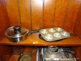 (BAY 6) SHELF LOT; COMES WITH AN ECHO MUFFIN TIN, CMA STAINLESS STEEL POT WITH LID, AND A OVAL CAST