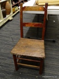 (R1) COUNTRY SIDE CHAIR; PRIMITIVE PLANK SEAT COUNTRY SIDE CHAIR. HAS A 2 SLAT BACK AND AN OLD RED