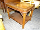 (R2) END TABLE; WOODEN END TABLE WITH A MULTI TONED TABLE TOP AND A LOWER SHELF. SITS ON 4 REEDED