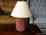 (R2) PINK TABLE LAMP; HAS A COOLIE SHAPED SHADE AND MEASURES 15 IN TALL.
