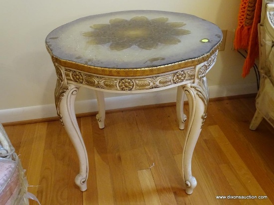 (LR) TABLE; ONE OF A PR. OF FRENCH PROVINCIAL ROUND LAMP TABLES WITH GOLD TOP WITH A GLASS TOP,
