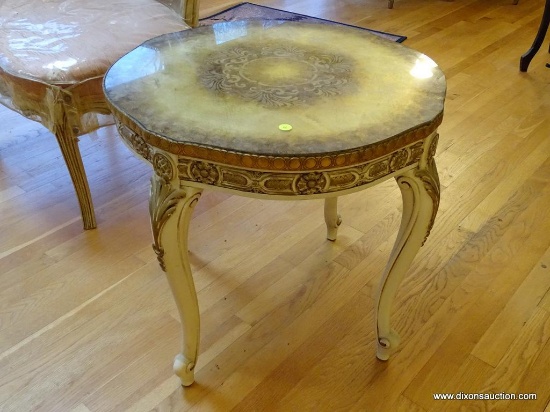 (LR) TABLE; ONE OF A PR. OF FRENCH PROVINCIAL ROUND LAMP TABLES WITH GOLD TOP WITH A GLASS TOP,
