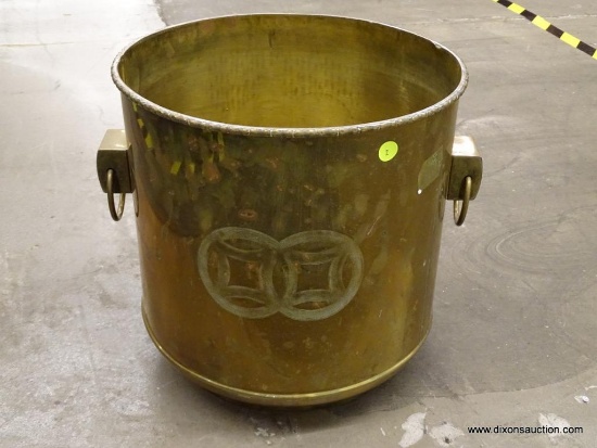 (WINDOW) BRASS BUCKET; LARGE BRASS BUCKET WITH 2 RING HANDLES AND A ROPED RIM. MEASURES 14 IN TALL