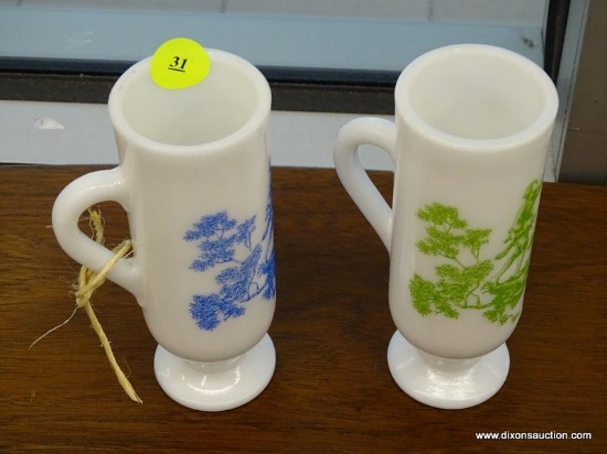 (WINDOW) PAIR OF MILK GLASS TEACUPS; TWO PIECE LOT TO INCLUDE ONE MILK GLASS TEACUP WITH GREEN AND