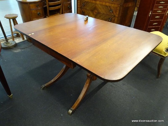 (R1) DROP LEAF TABLE; DOUBLE PEDESTAL DROP LEAF TABLE WITH TWO 15 IN LEAVES THAT HAVE PULL-OUT BAR