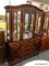 (R2) CHINA CABINET; 2 PC. ARCHED TOP, WOODEN CHINA CABINET. TOP PIECE HAS AN ARCHED TOP WITH 3