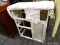 (R2) BABY CHANGING TABLE; WHITE PAINTED BABY CHANGING TABLE WITH SLOTS FOR 3 BASKETS ON THE LEFT AND