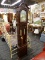 (R3) GRANDFATHER CLOCK; WOODEN GRANDFATHER CLOCK WITH A BROKEN ARCH PEDIMENT TOP AND TURNED POLE