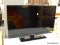 (R4) INSIGNIA 28 IN LED TV. HAS 2 HDMI PORTS. BUTTONS ARE ON THE BOTTOM. NEEDS POWER CORD.