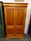 (R4) ENTERTAINMENT ARMOIRE; WOODEN, ENTERTAINMENT ARMOIRE WITH 2 TOP DOORS REVEALING A SLIDE OUT