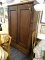 (R5) ARMOIRE; WOODEN ARMOIRE WITH SCROLL DETAILED SIDES AND 2 FRONT CABINET DOORS THAT OPEN TO