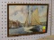(LWALL) PRINT OF PEOPLE SAILING; PRINT OF PEOPLE SAILING ALONG THE COAST WITH AN OLD HOME IN THE