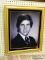 (LWALL) SENIOR PHOTO PRINT; VINTAGE SENIOR PHOTO OF A BOY IN A SUIT. SITS IN A GOLD TONED FRAME WITH