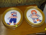 (R3) RAGGEDY ANN AND ANDY FRAMED NEEDLEPOINTS; PAIR OF WOVEN RAGGEDY ANN AND ANDY NEEDLEPOINTS IN