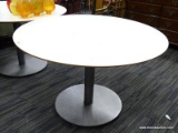 (R3) MODERN KITCHEN TABLE; ROUND KITCHEN TABLE, WHITE IN COLOR. HAS SILVER METAL BASE. MEASURES 29