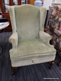 (R3) WINGBACK ARMCHAIR; GREEN UPHOLSTERED WINGBACK CHAIR WITH ROLLING ARMS, CABRIOLE LEGS AND A