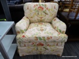 (R4) THE CHARLES STEWART COMPANY CUSHIONED ARM CHAIR; HAS A TROPHY URN VASE AND FLORAL PATTERNED,